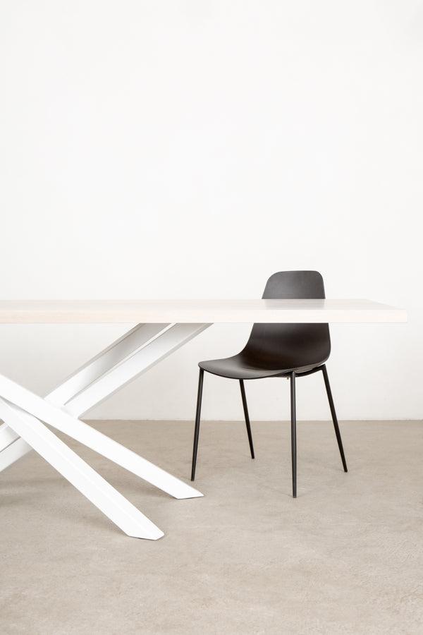 white dining table with sculptural base